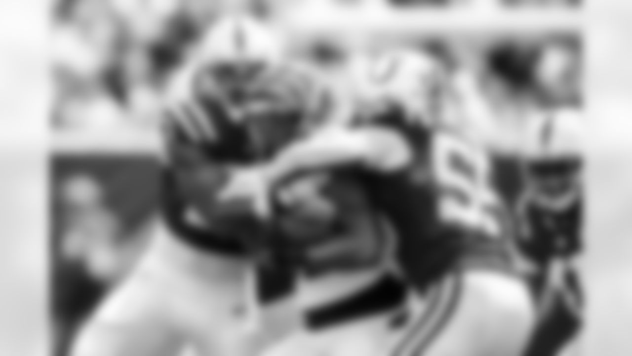 LB Solomon DeShields #53 and DE Isaiah Land #55