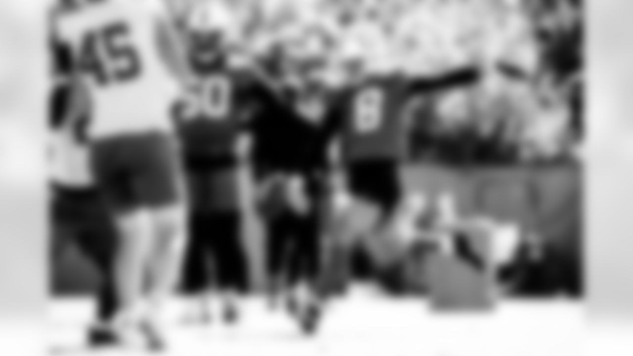 LB Segun Olubi #50 and P Rigoberto Sanchez #8