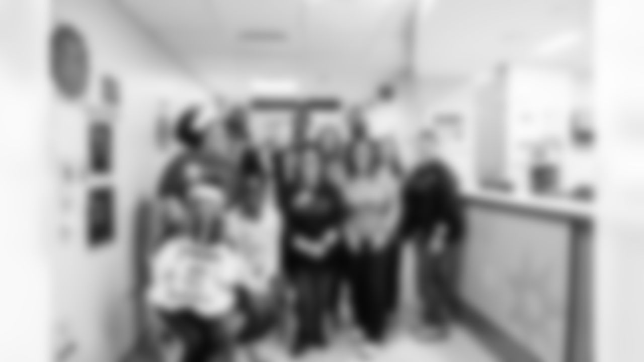 Allison B., DE Viliami Fehoko Jr. #96, WR Eli Pancol #83 and LB Austin Ajiake #58