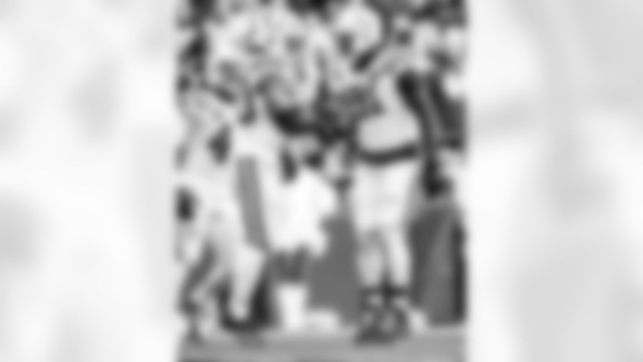 DE Kwity Paye #51 and S Nick Cross #20