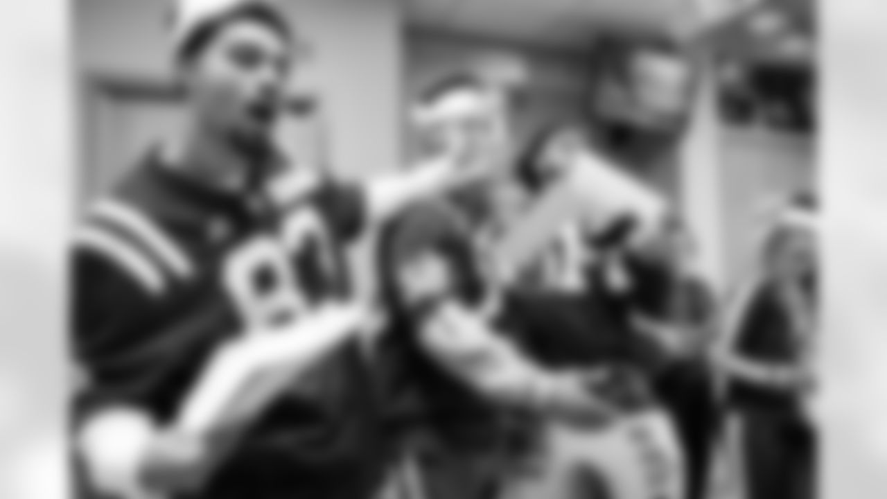 WR Eli Pancol #83, LB Austin Ajiake #58, DE Viliami Fehoko Jr. #96 and Allison B.