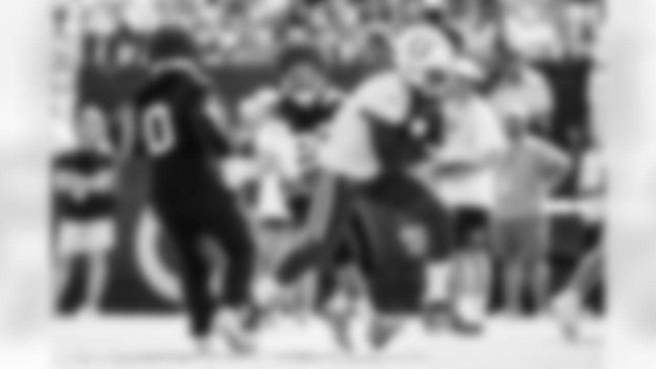 S Camryn Bynum #0, S Nick Cross #20 and TE Mo Alie-Cox #81