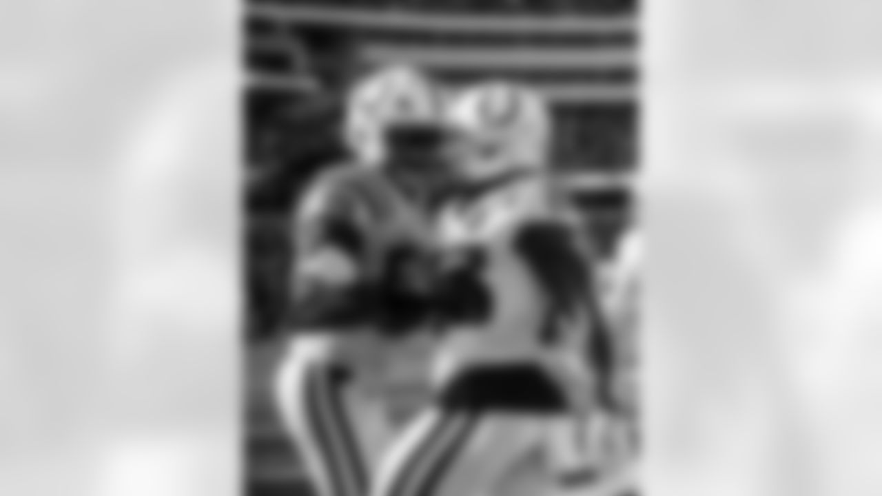 LB Buddy Johnson #59 and RB Ameer Abdullah #26