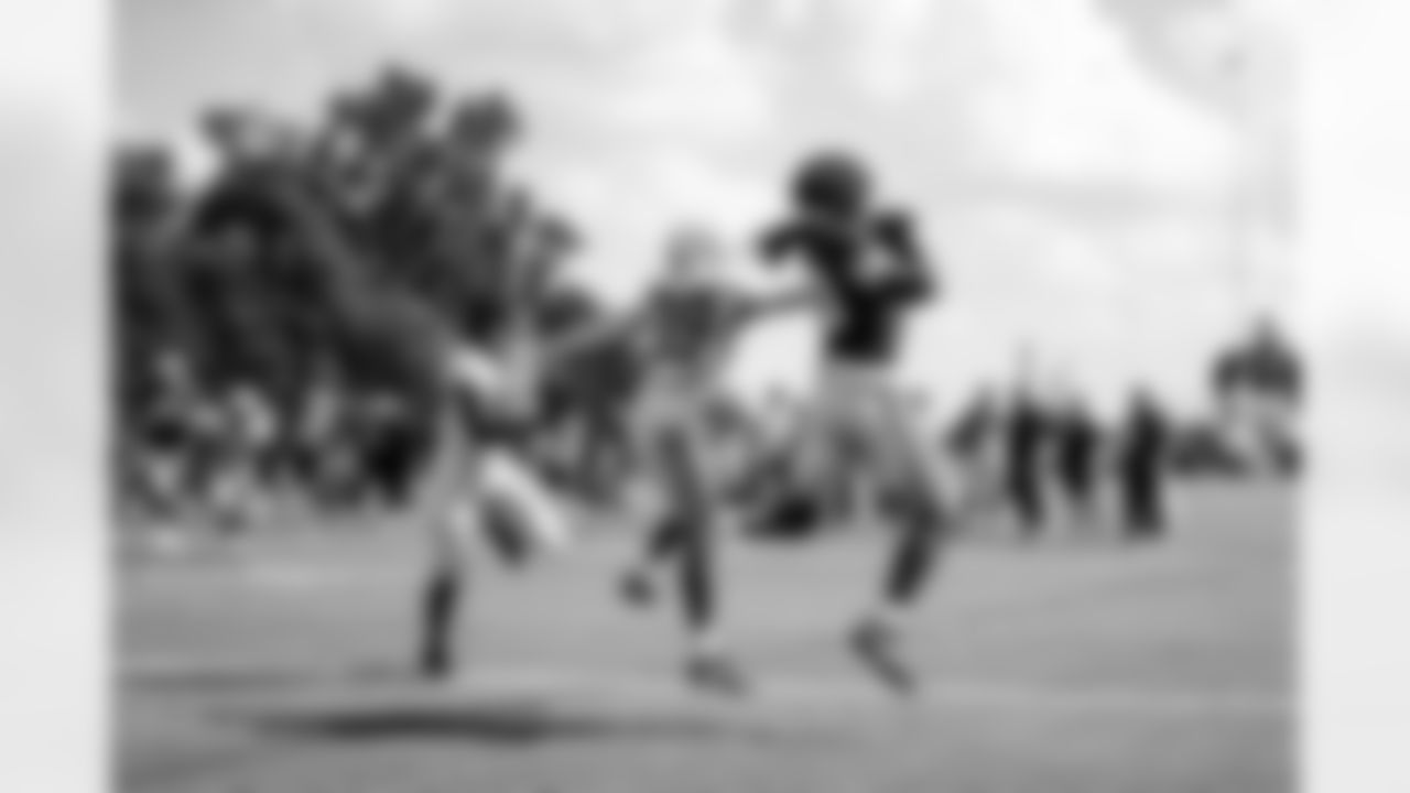 CB Alex Johnson #39, TE Jelani Woods #80 and DE Isaiah Land #55