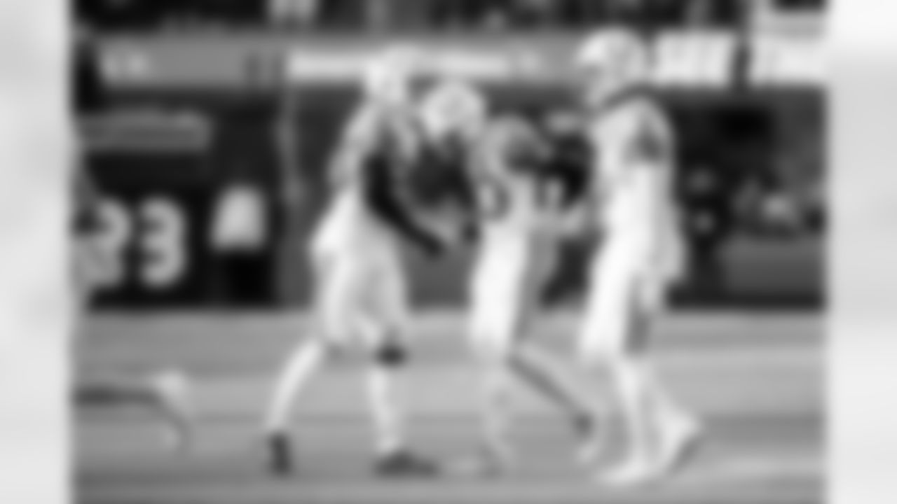 S Nick Cross #20, CB Kenny Moore II #23 and S Camryn Bynum #0