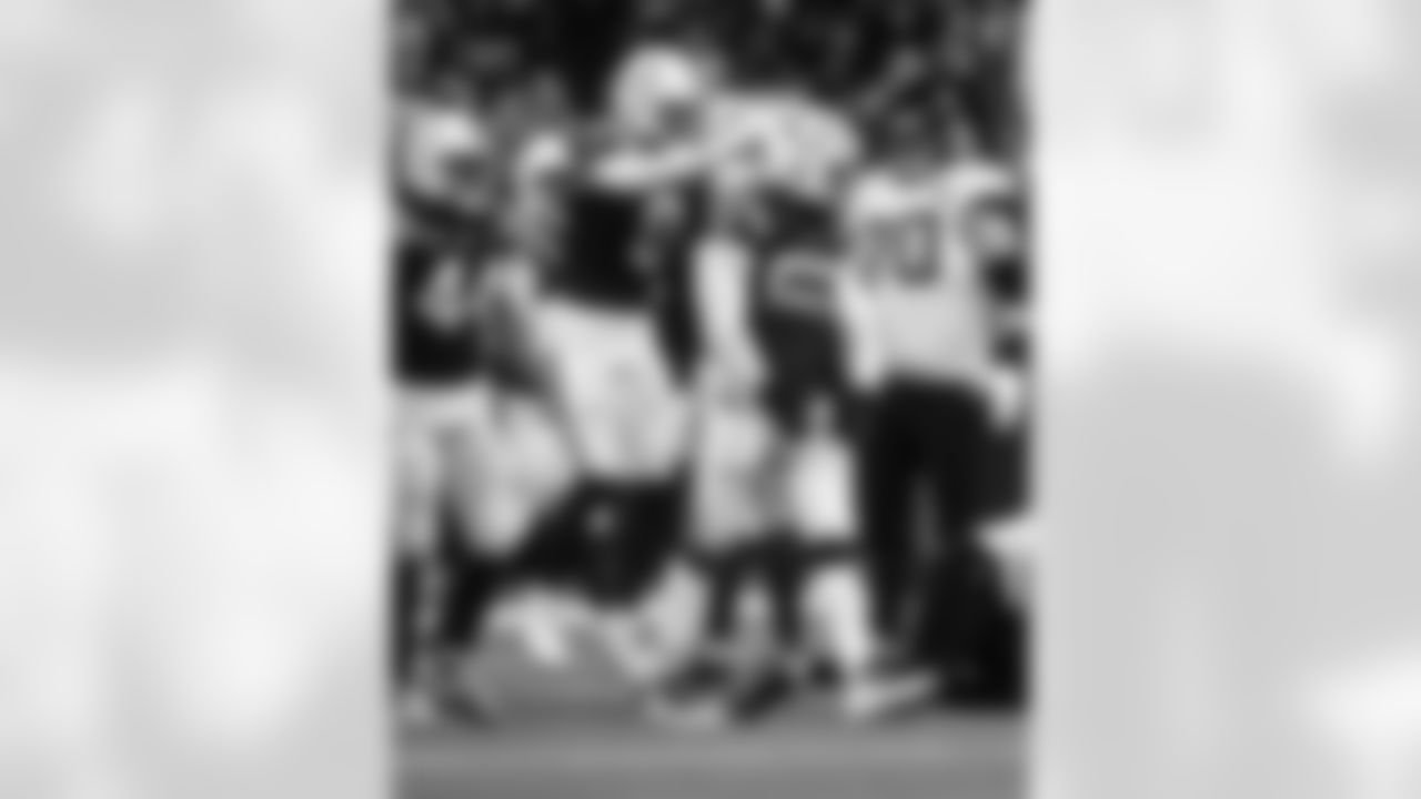 LB Zaire Franklin #44, S Camryn Bynum #0 and DE Samson Ebukam #52