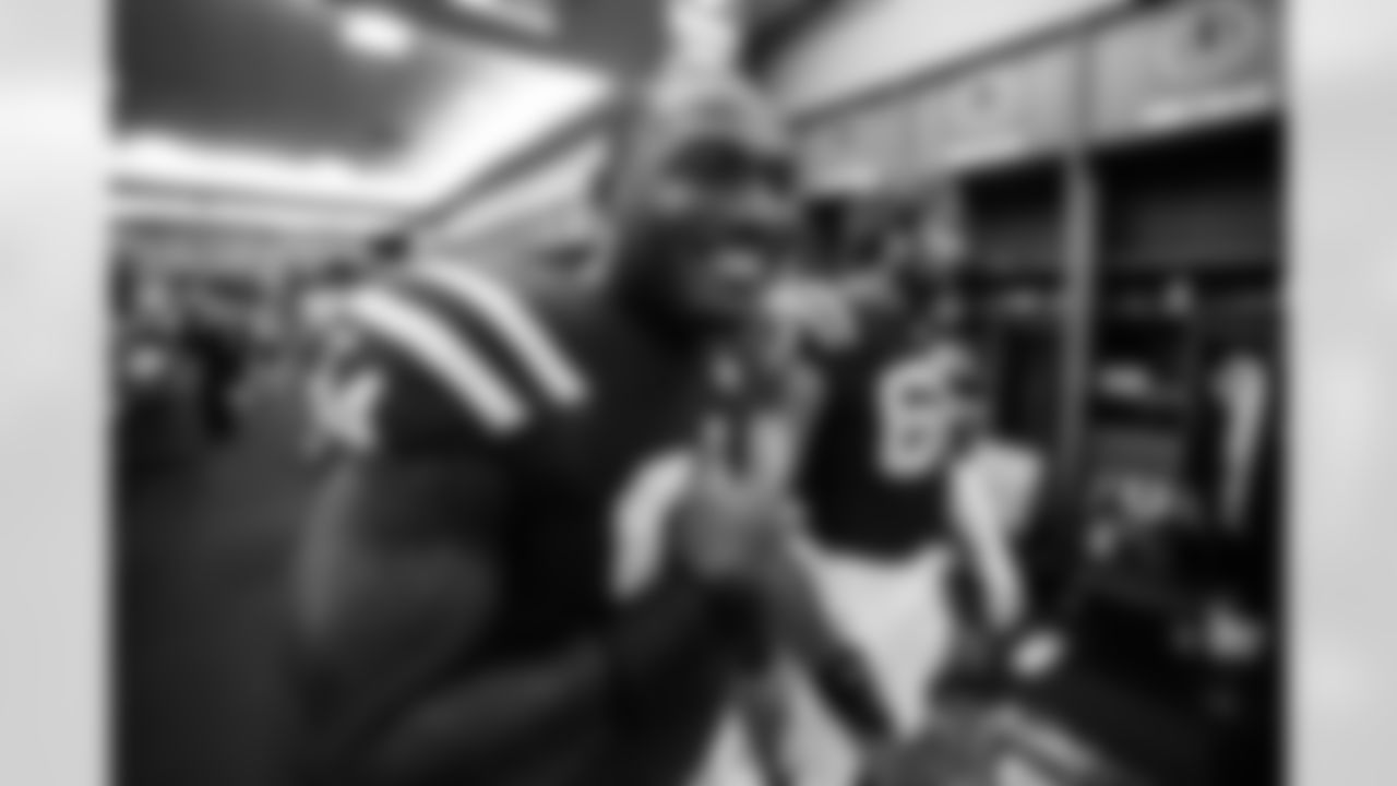 DE Tyquan Lewis #94 and G Tanor Bortolini #60