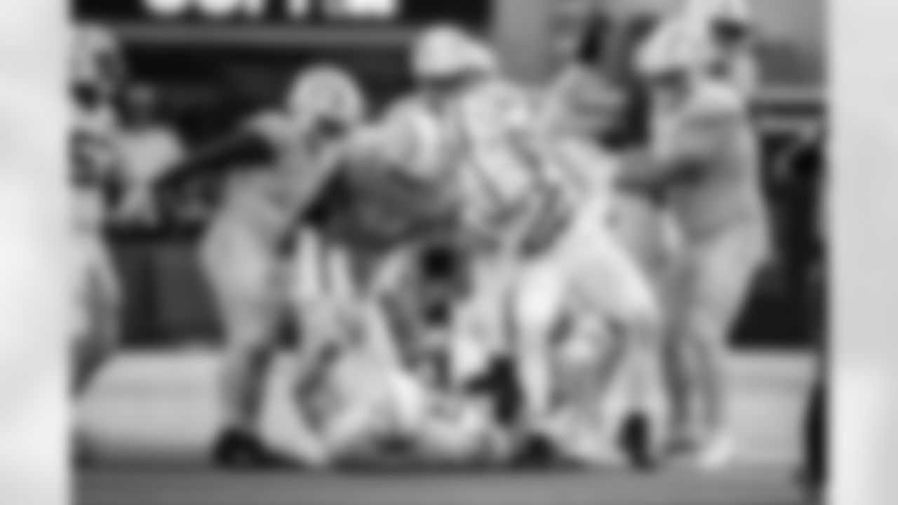 DT Grover Stewart #90 and DE Samson Ebukam #52