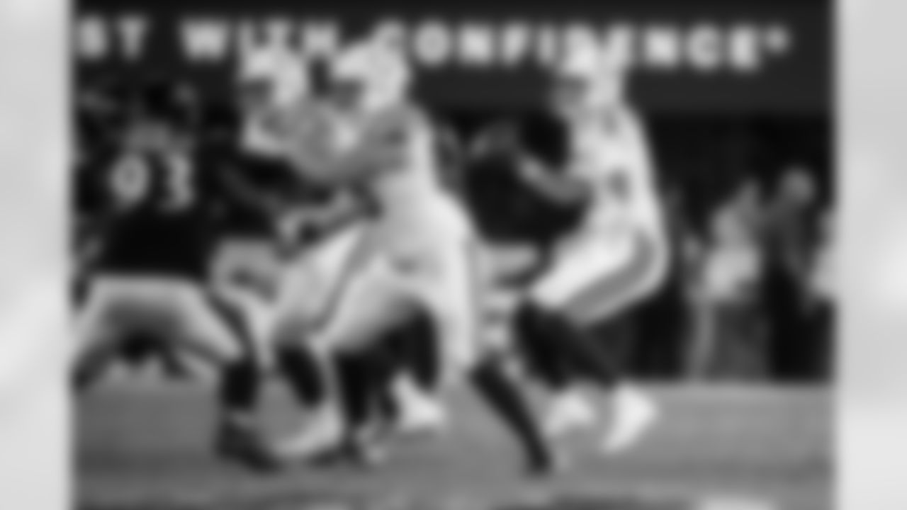 T Jalen Travis #75, G Josh Sills #65 and QB Riley Leonard #15
