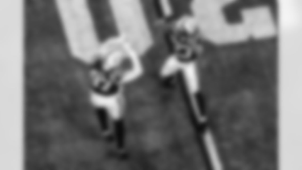 DE Laiatu Latu #97 and CB Kenny Moore II #23