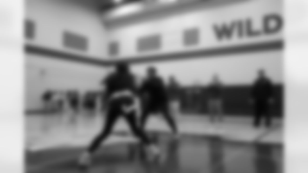Colts linebacker Zaire Franklin celebrates with a student during a drill during a GENYOUth clinic on Tuesday, Feb. 24, 2026, at Fall Creek Valley Middle School in Indianapolis. (Jerod Ringwald/AP Content Services for the NFL)