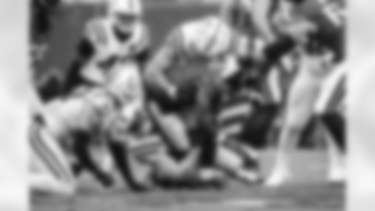 DE Laiatu Latu #97, CB Jaylon Jones #40 and DT Chris Wormley #96