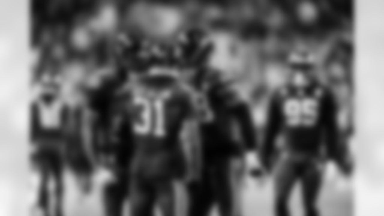 CB Jaylon Jones #40, RB Tyler Goodson #31 and LB Austin Ajiake #58