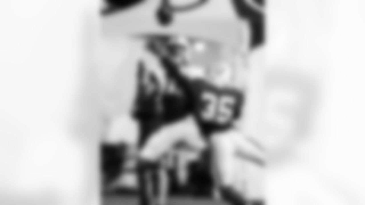 WR Adonai Mitchell #10 and CB Johnathan Edwards #35