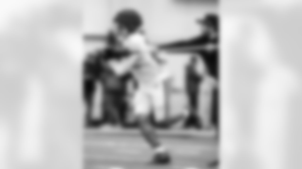 RB Jonathan Taylor #28 and Diego Ortiz - Tony Dungy Diversity Coaching Fellow