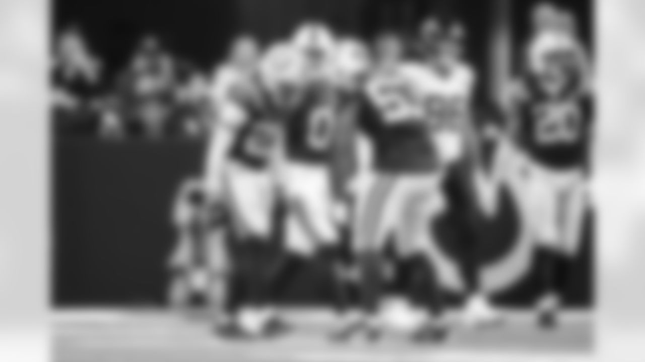 S Camryn Bynum #0, LB Germaine Pratt #53 and CB Kenny Moore II #23