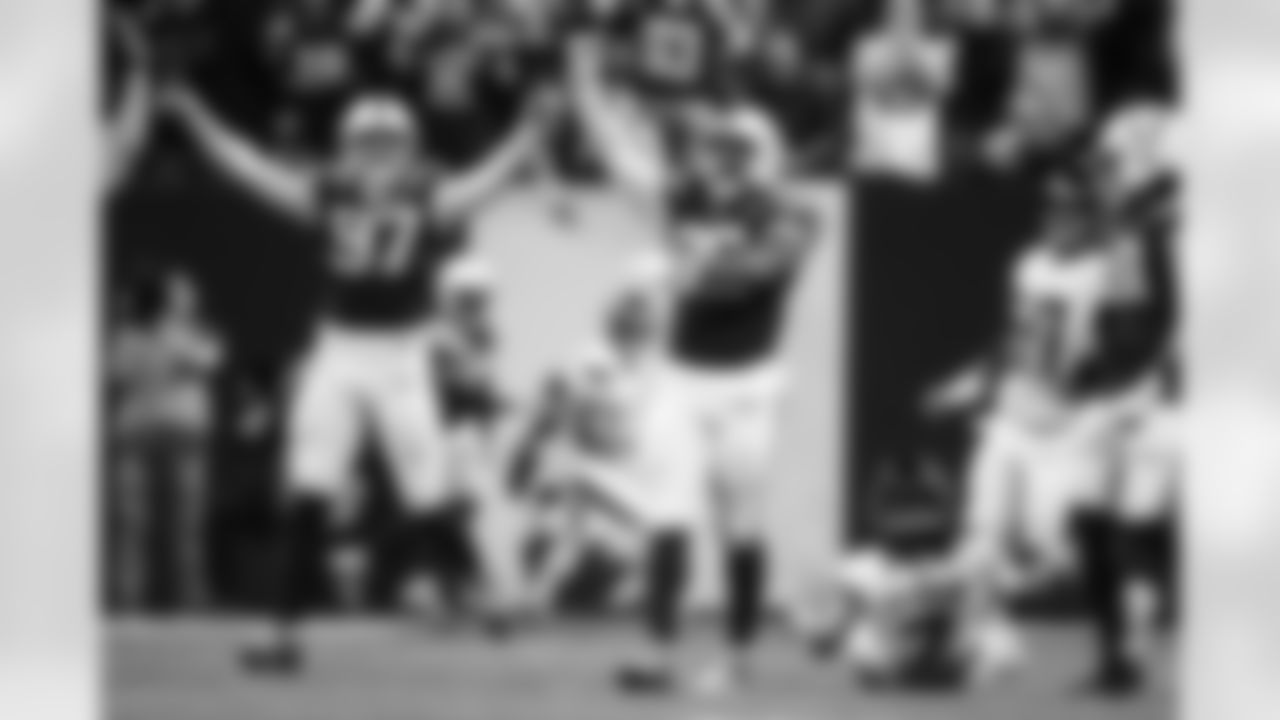 DE Laiatu Latu #97, DT Adetomiwa Adebawore #95 and DE J.T. Tuimoloau #91