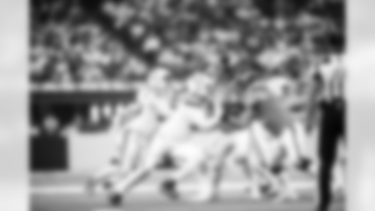 DL Adetomiwa Adebawore #95 and DE JT Tuimoloau #91