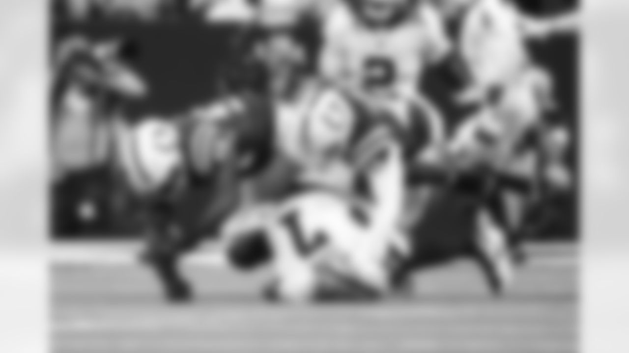 DL Tyquan Lewis #94 and LB Zaire Franklin #44