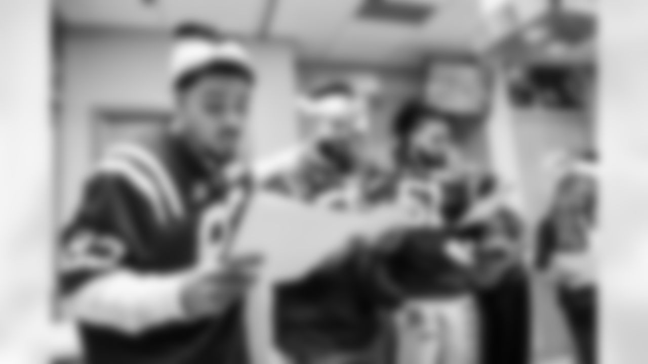 WR Eli Pancol #83, LB Austin Ajiake #58, DE Viliami Fehoko Jr. #96 and Allison B.