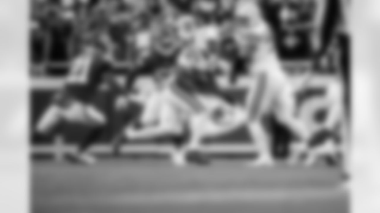 RB Jonathan Taylor #28 and G Matt Goncalves #71