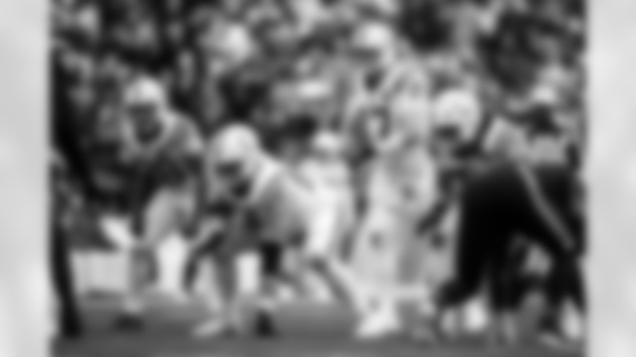 G Tanor Bortolini #60 and QB Philip Rivers #17