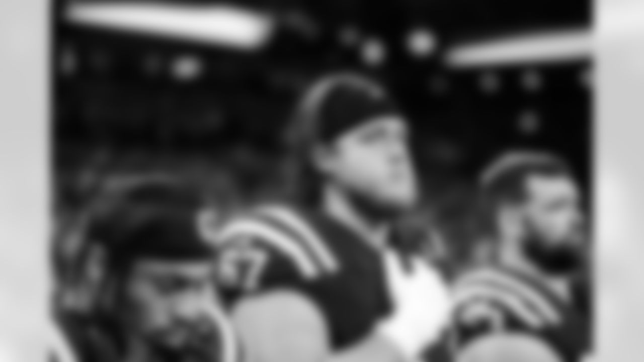 RB Jonathan Taylor #28 and T Luke Tenuta #67