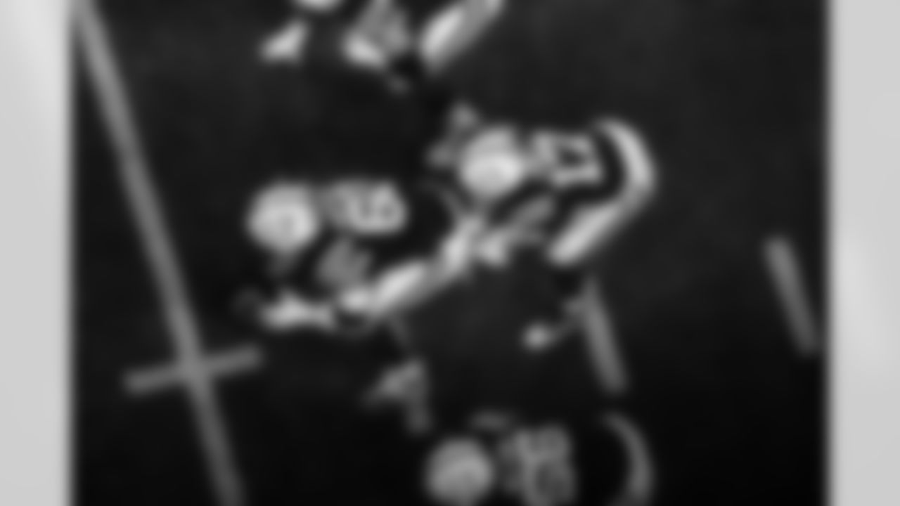 C Tanor Bortolini #60, G Quenton Nelson #56 and QB Daniel Jones #17