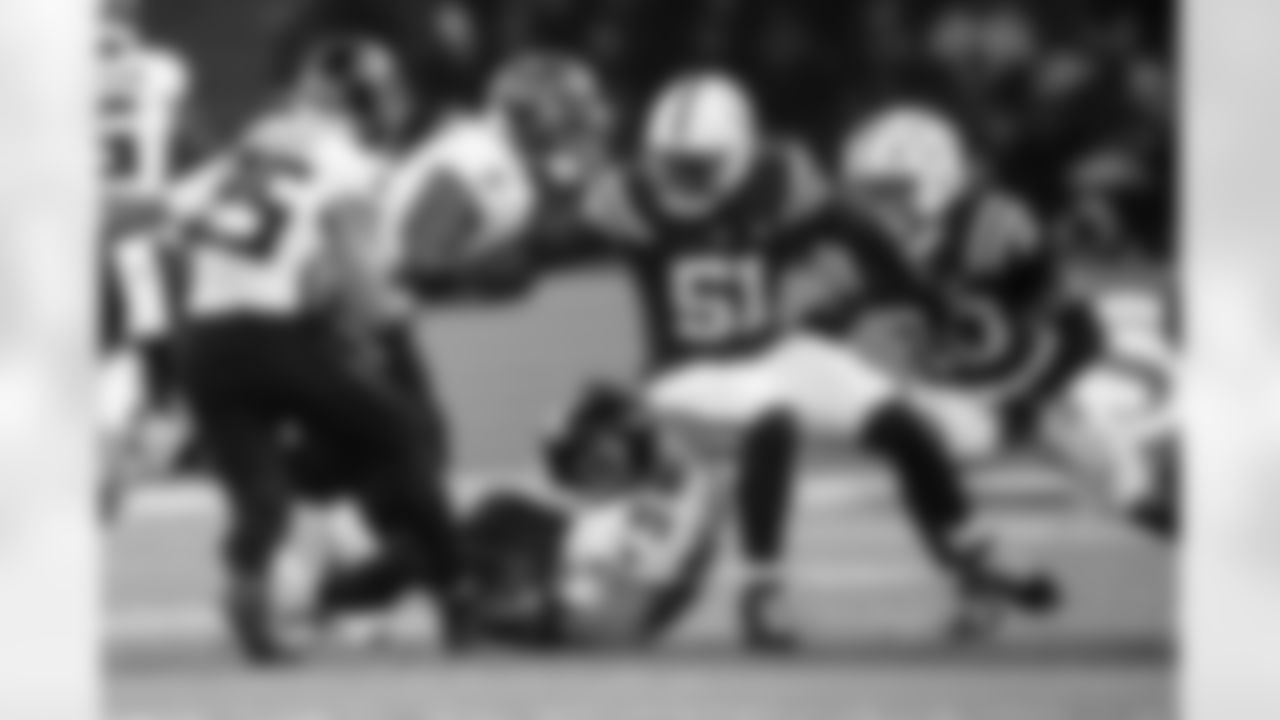 DE Kwity Paye #51 and S Nick Cross #20