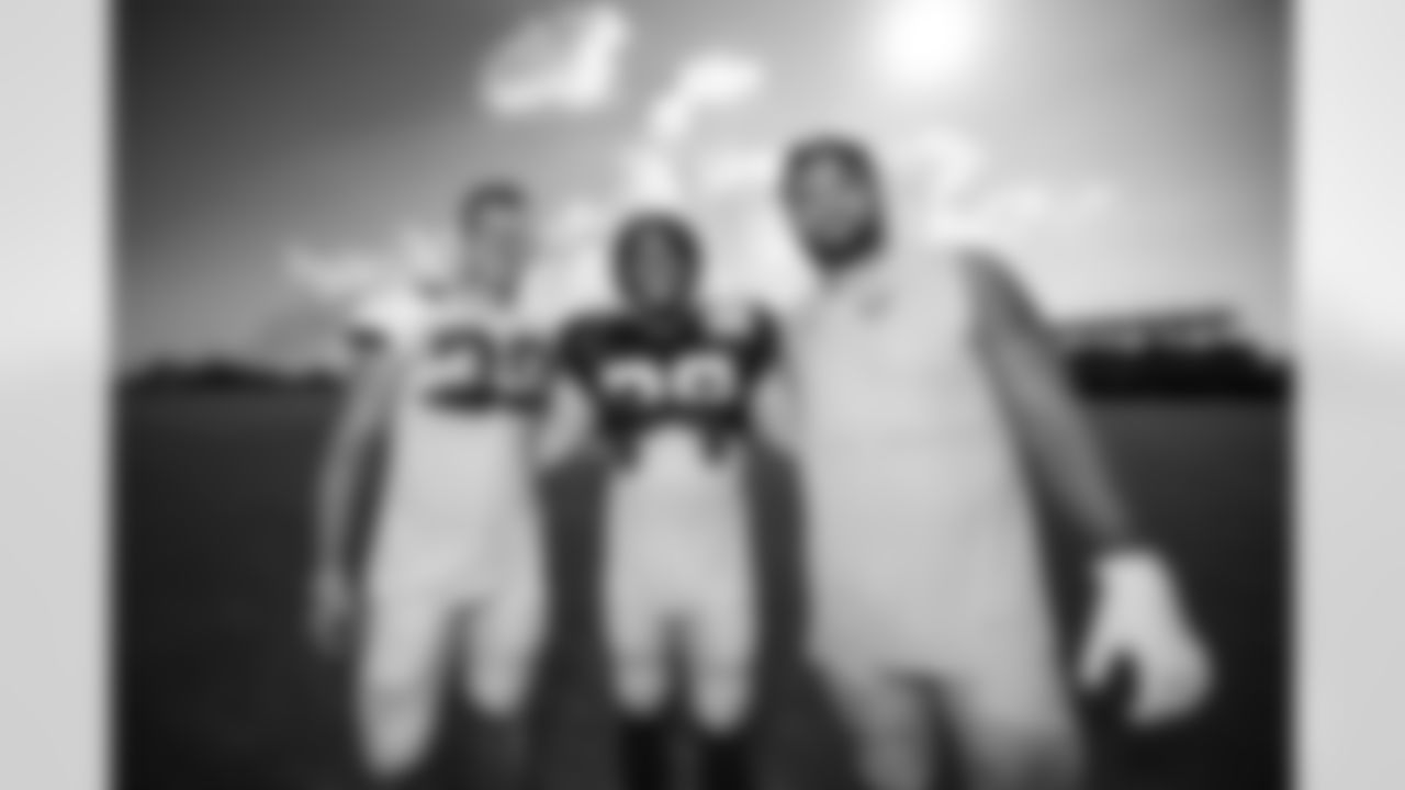 S Hunter Wohler #30, RB Jonathan Taylor #28 and G Tanor Bortolini #60