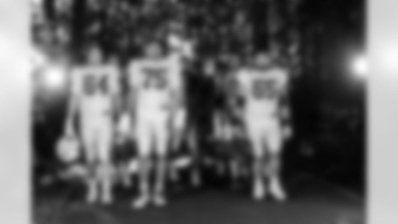 T Marshall Foerner #64, T Jalen Travis #75 and C Mose Vavao #67