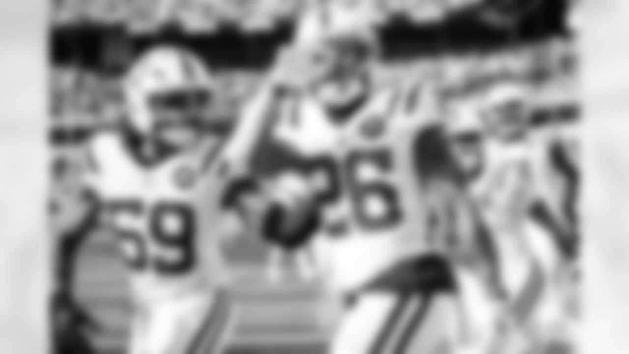 LB Buddy Johnson #59 and RB Ameer Abdullah #26