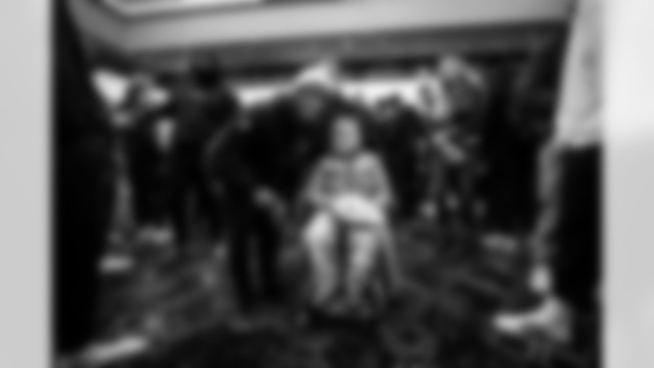 DT Neville Gallimore #92, RB Jonathan Taylor #28 and Ande Sadtler - Director of Community Impact