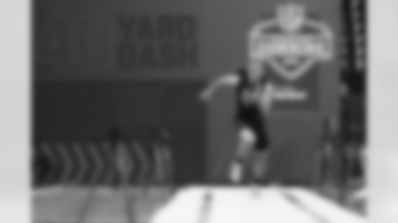 Cincinnati wide receiver Alec Pierce (24) runs the 40-yard dash at the NFL football scouting combine, Thursday, March 3, 2022 in Indianapolis. (Ben Liebenberg via AP)