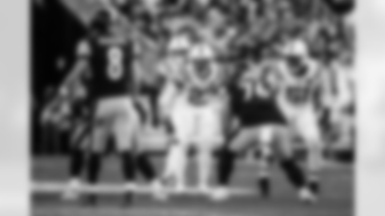 CB Kenny Moore II #23 and DE Kwity Paye #51