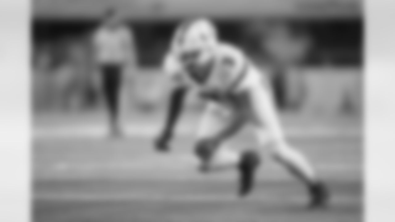Miami defensive lineman Akheem Mesidor rushes in on the Ohio State offense during the first half of the Cotton Bowl College Football Playoff quarterfinal game Wednesday, Dec. 31, 2025, in Arlington, Texas. (AP Photo/Julio Cortez)