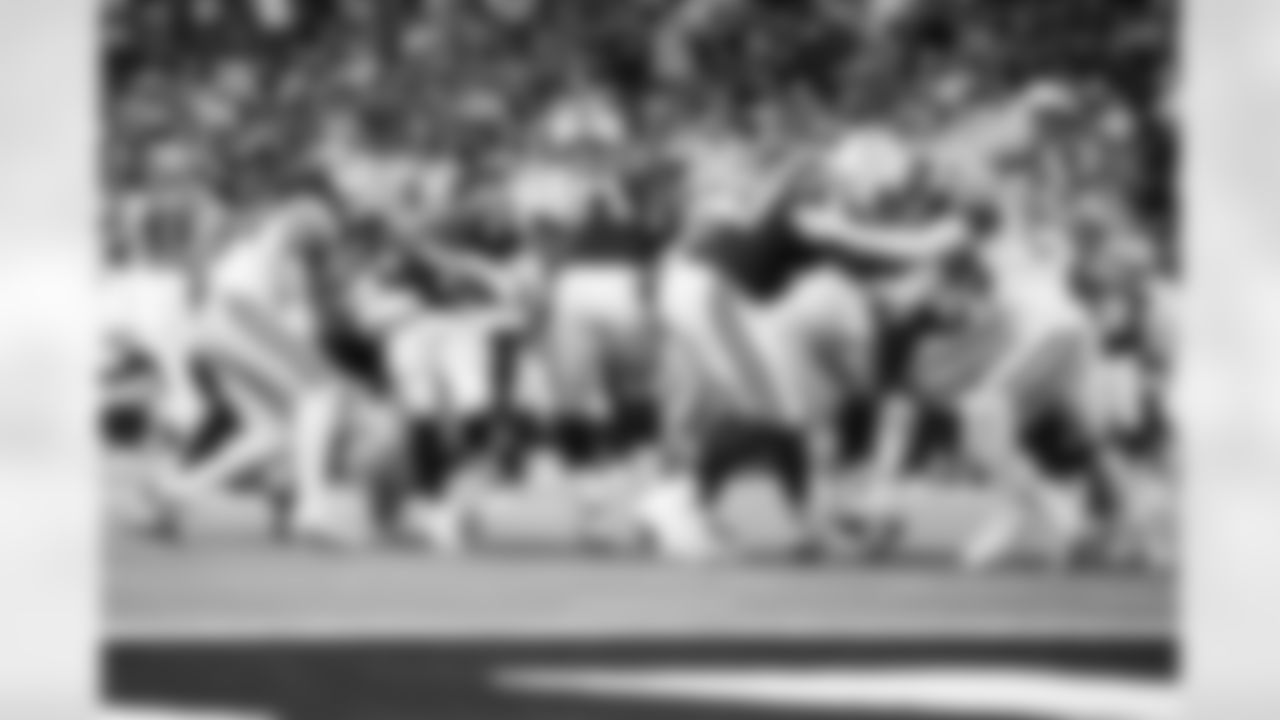 RB DJ Giddens #21, T Matt Goncalves #71 and T Jalen Travis #75