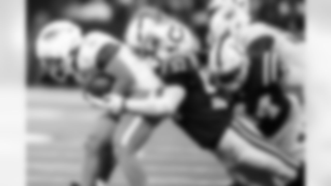 LB Jaylon Carlies #57 and LB Zaire Franklin #44