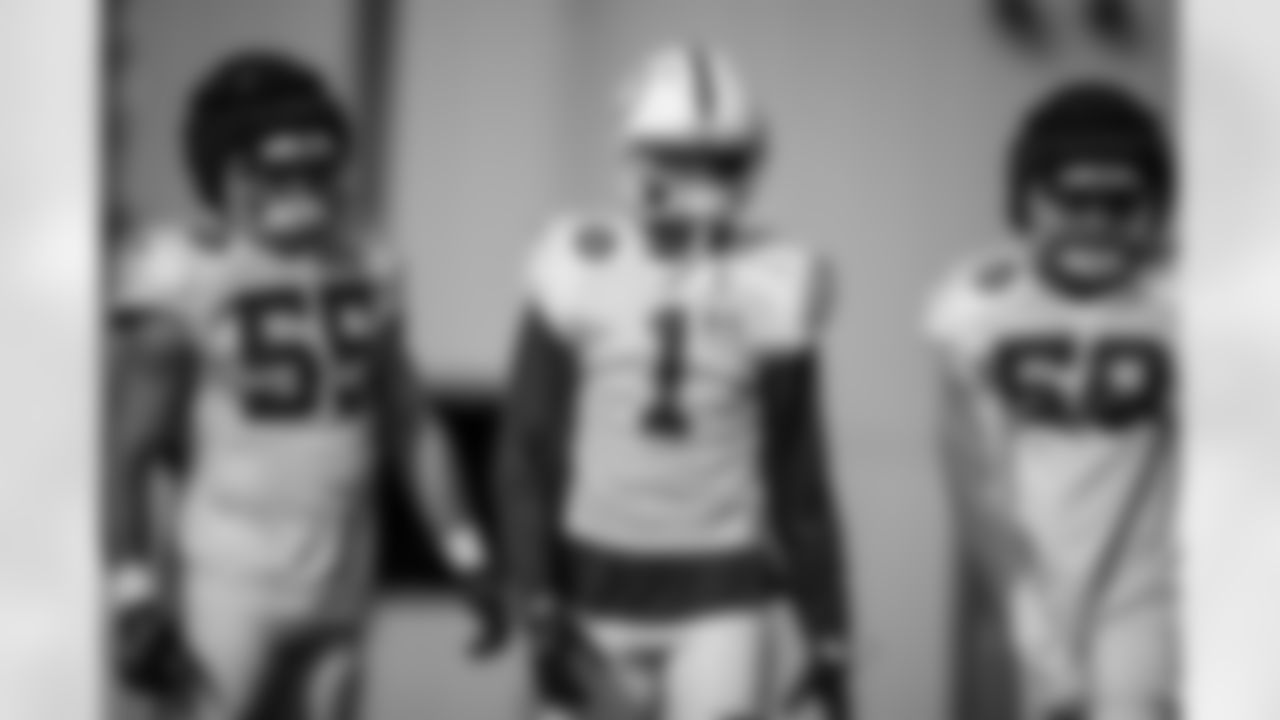 LB Chad Muma #55, CB Sauce Gardner #1 and LB Austin Ajiake #58