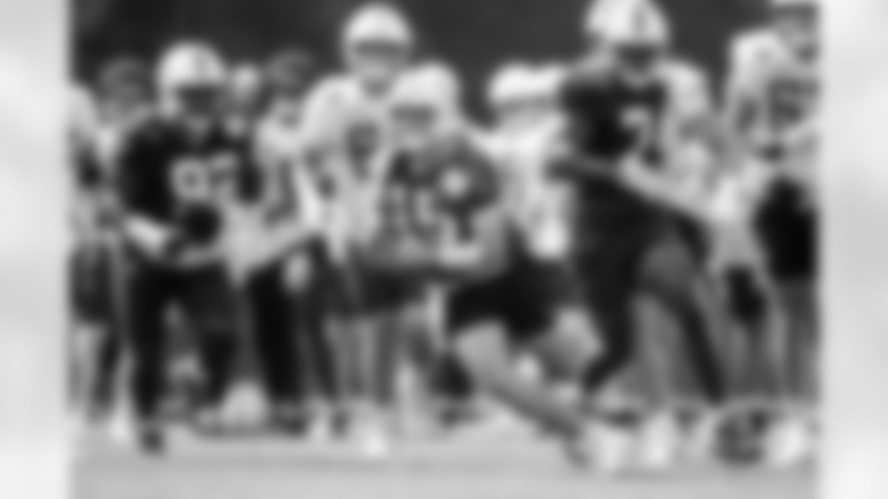 DT Neville Gallimore #92, QB Riley Leonard #15 and DE Durell Ncham i#74