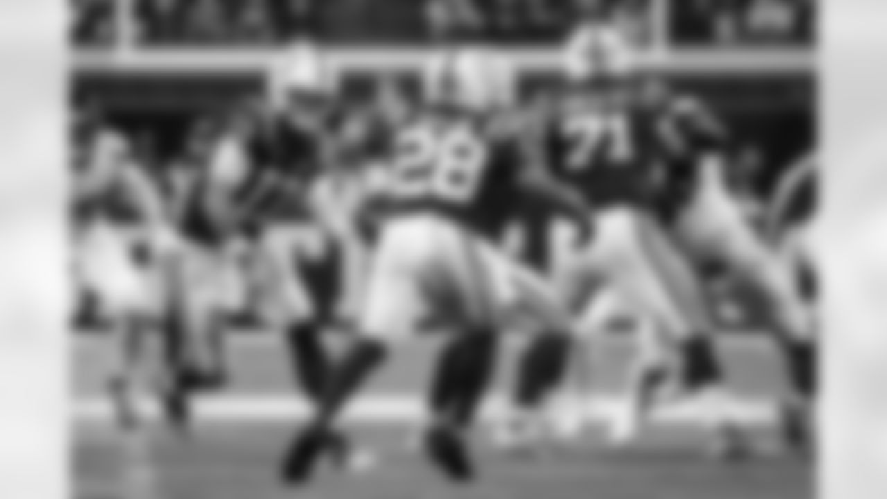 QB Daniel Jones #17, RB Jonathan Taylor #28 and G Matt Goncalves #71