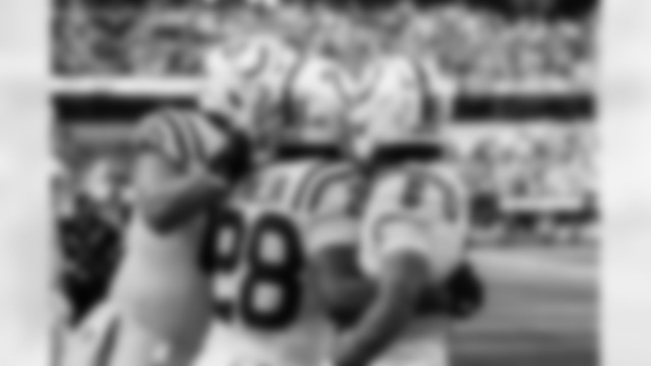 C Tanor Bortolini #60, RB Jonathan Taylor #28 and WR Anthony Gould #6
