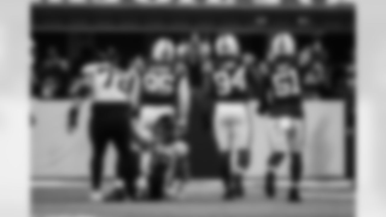 DT Adetomiwa Adebawore #95, DE Tyquan Lewis #94 and DE Kwity Paye #51