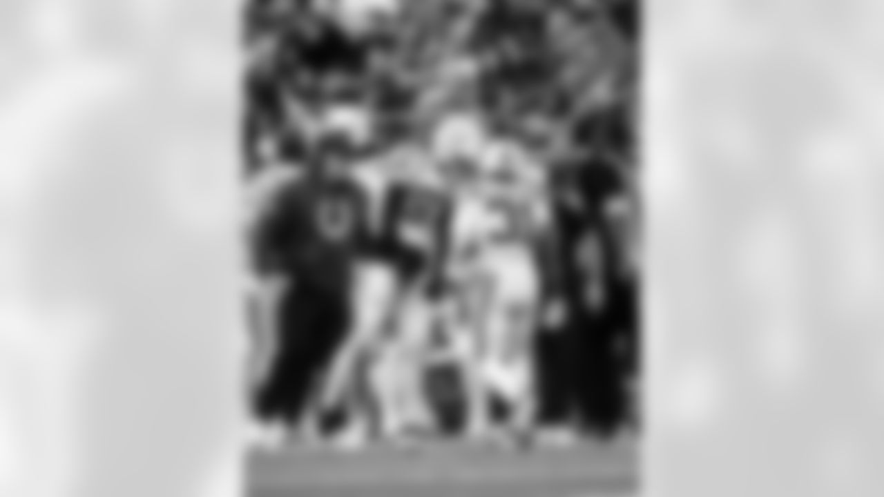 DE Laiatu Latu #97 and RB Tyler Goodson #31