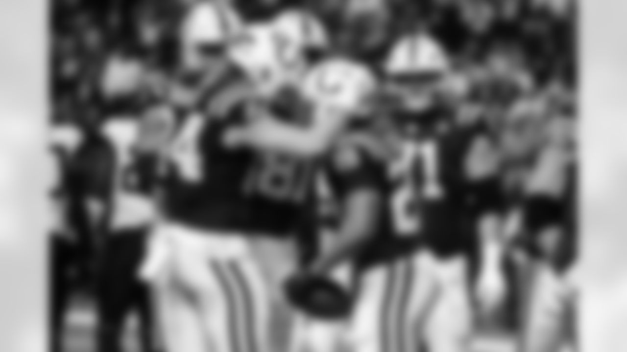 TE Tyler Warren #84, RB Jonathan Taylor #28 and G Matt Goncalves #71