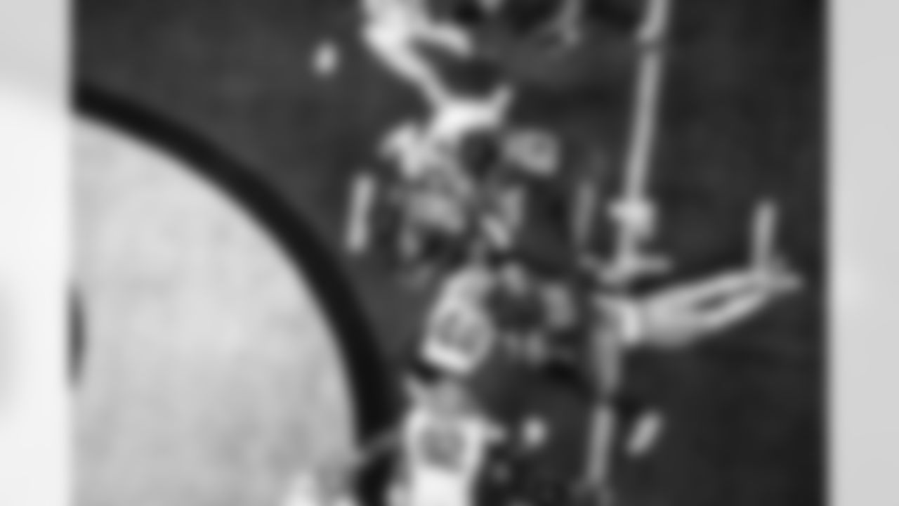 RB Jonathan Taylor #28, C Danny Pinter #63 and G Quenton Nelson #56