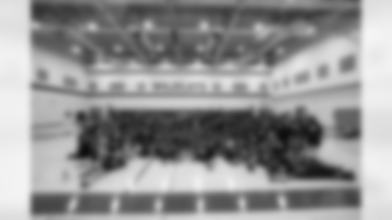 Fall Creek Valley students pose for a group photo during a GENYOUth clinic on Tuesday, Feb. 24, 2026, at Fall Creek Valley Middle School in Indianapolis. (Jerod Ringwald/AP Content Services for the NFL)