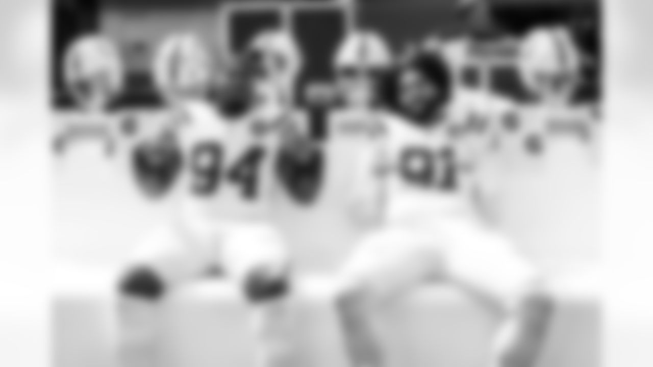 DE Tyquan Lewis #94 and DE JT Tuimoloau #91