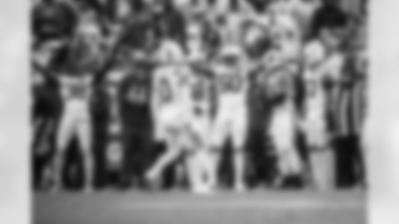 S Camryn Bynum #0 and LB Segun Olubi #50