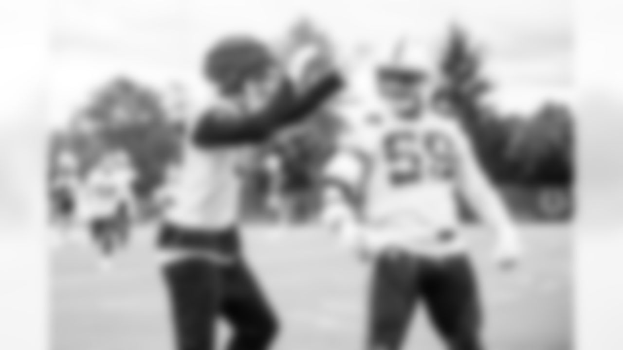 LB Cameron McGrone #59 and S Camryn Bynum #0